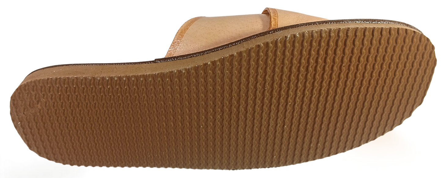 Three-quarter view of men's handmade beige leather house slide showing crossover strap construction and flexible rubber sole – The Leather Gift Co