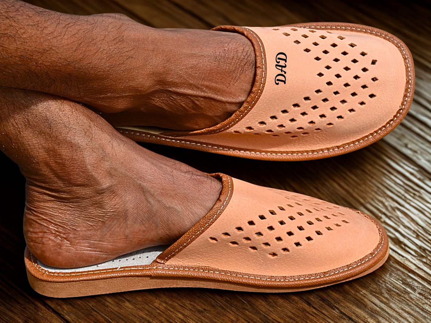 Man wearing natural leather closed toe house slippers indoors, handmade in Poland