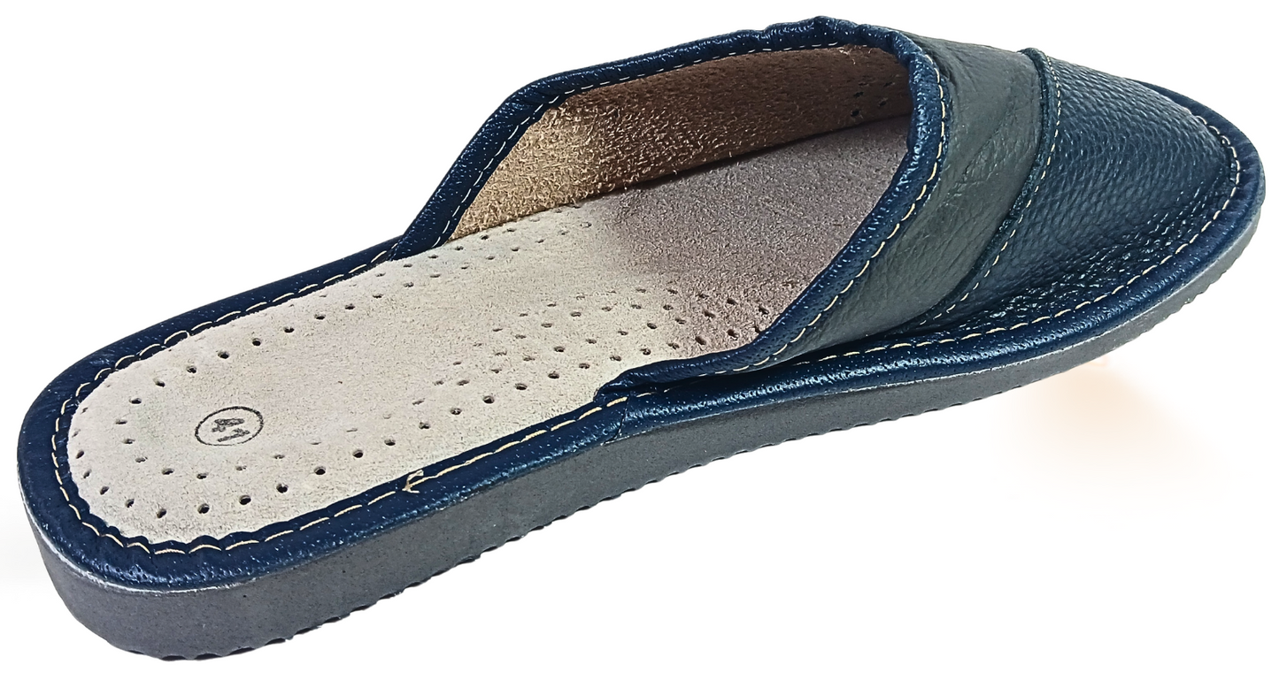 Top view of men's handmade leather slipper showing perforated detail panel and natural sheepskin insole