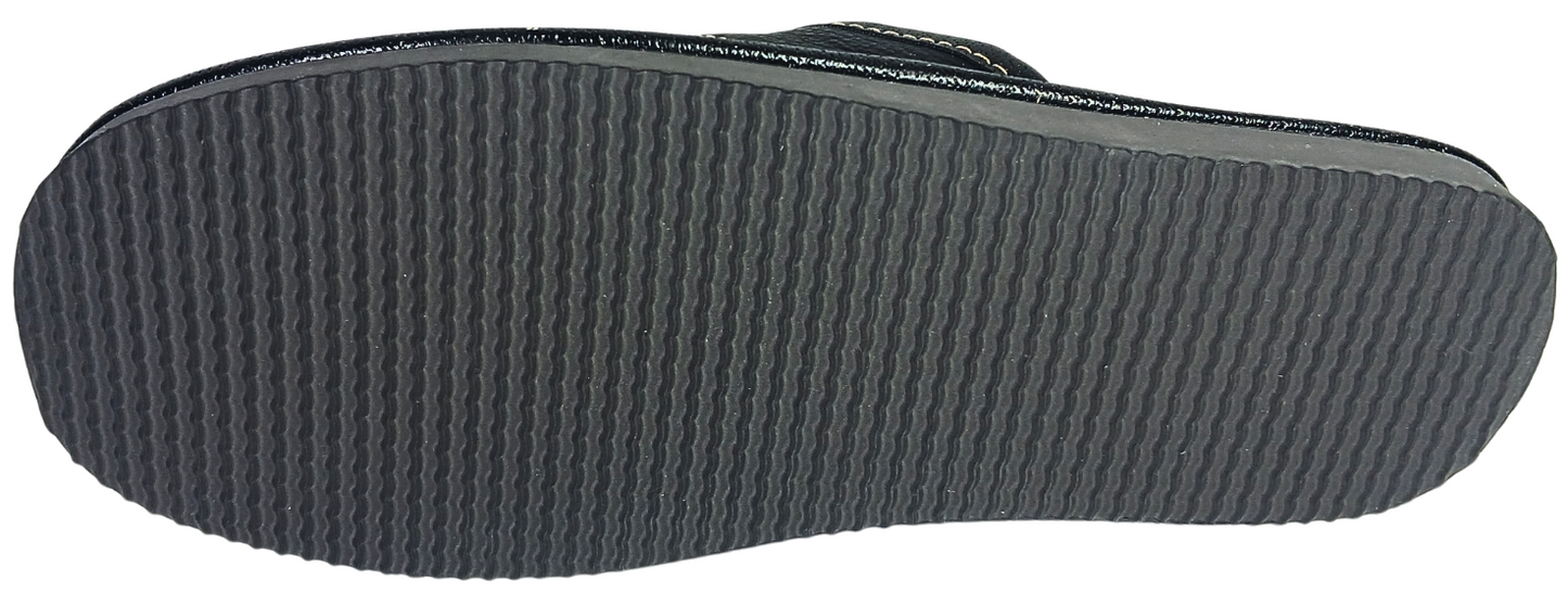 A close-up view of a dark gray textured sole of black leather slippers for men, showing the ribbed tread pattern and a thin black edge trim against a white background.