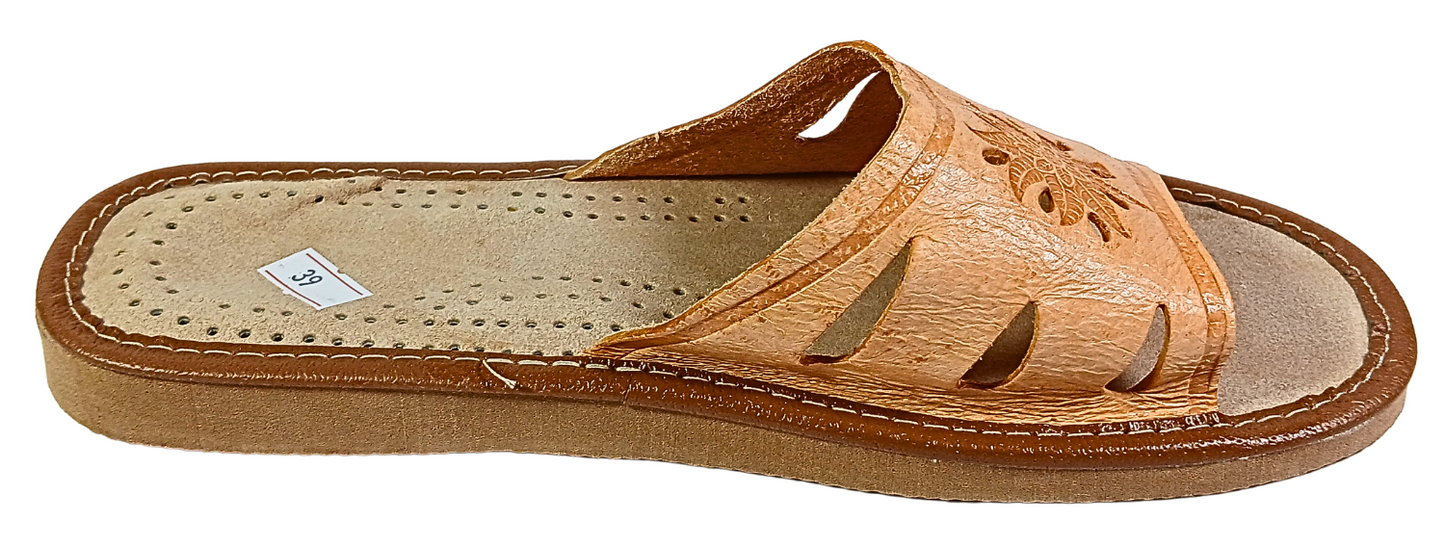 Handmade tan leather slide slipper with floral stamp — top-down view showing perforated sheepskin insole