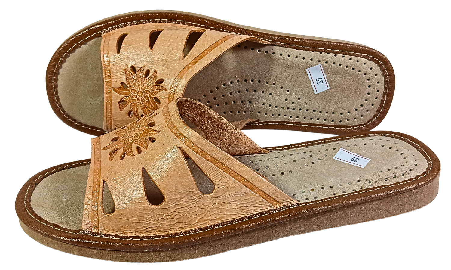 Tan leather women's slide slipper worn on foot — lifestyle indoor shot