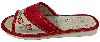 Red leather women's house slide — side profile showing cream embroidered panel and sole thickness