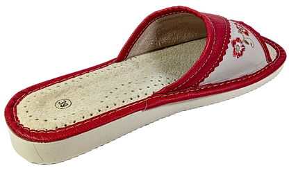 Red leather open toe slipper worn on foot — lifestyle indoor shot