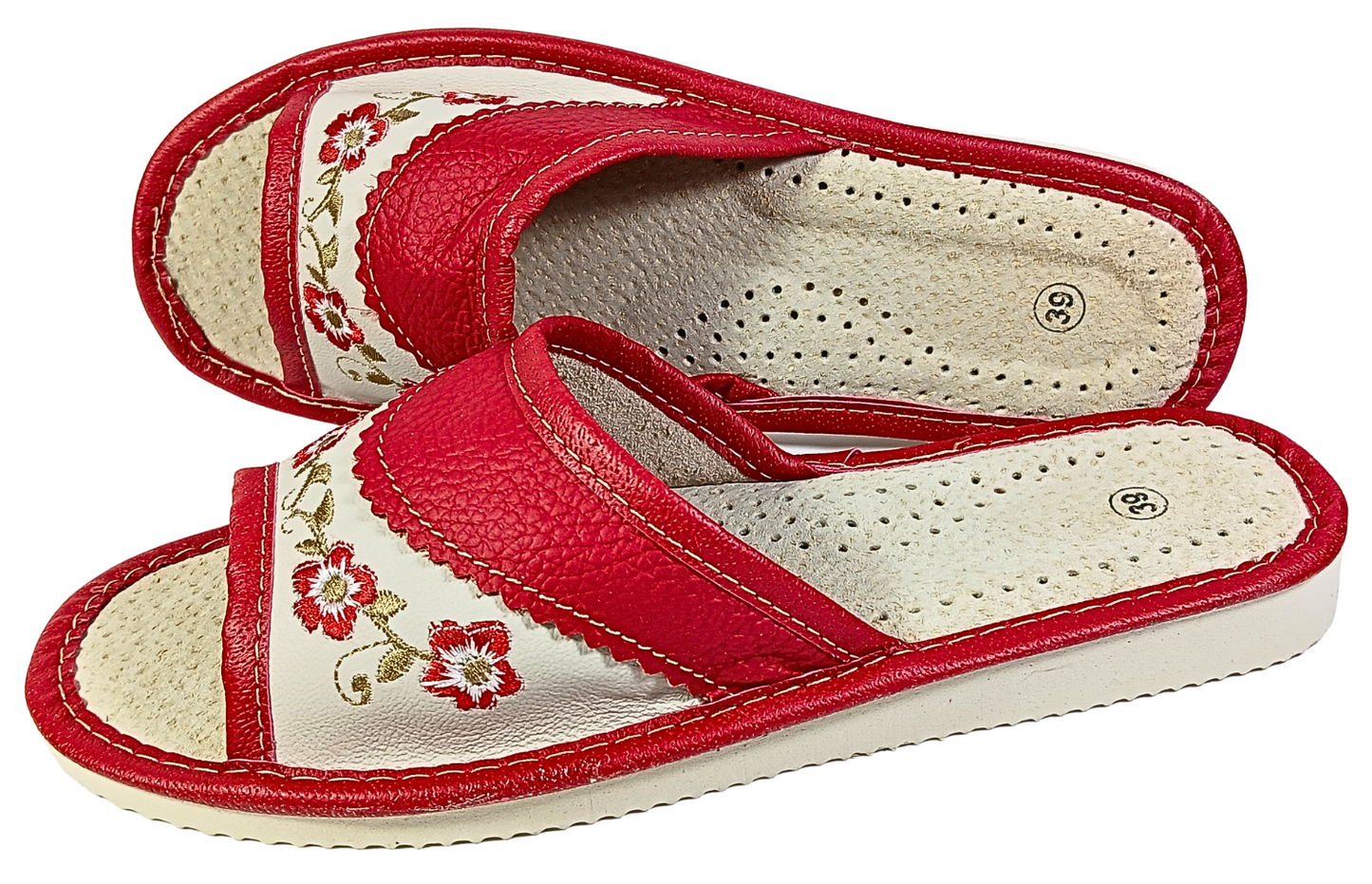 Red leather slide slipper — sole view showing white rubber outsole and traction pattern