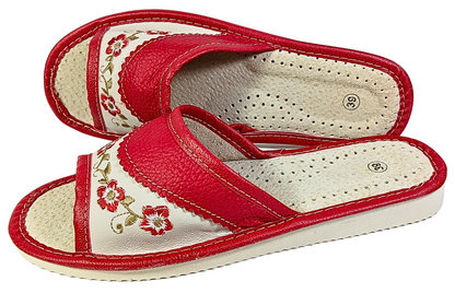 Red leather slide slipper — sole view showing white rubber outsole and traction pattern