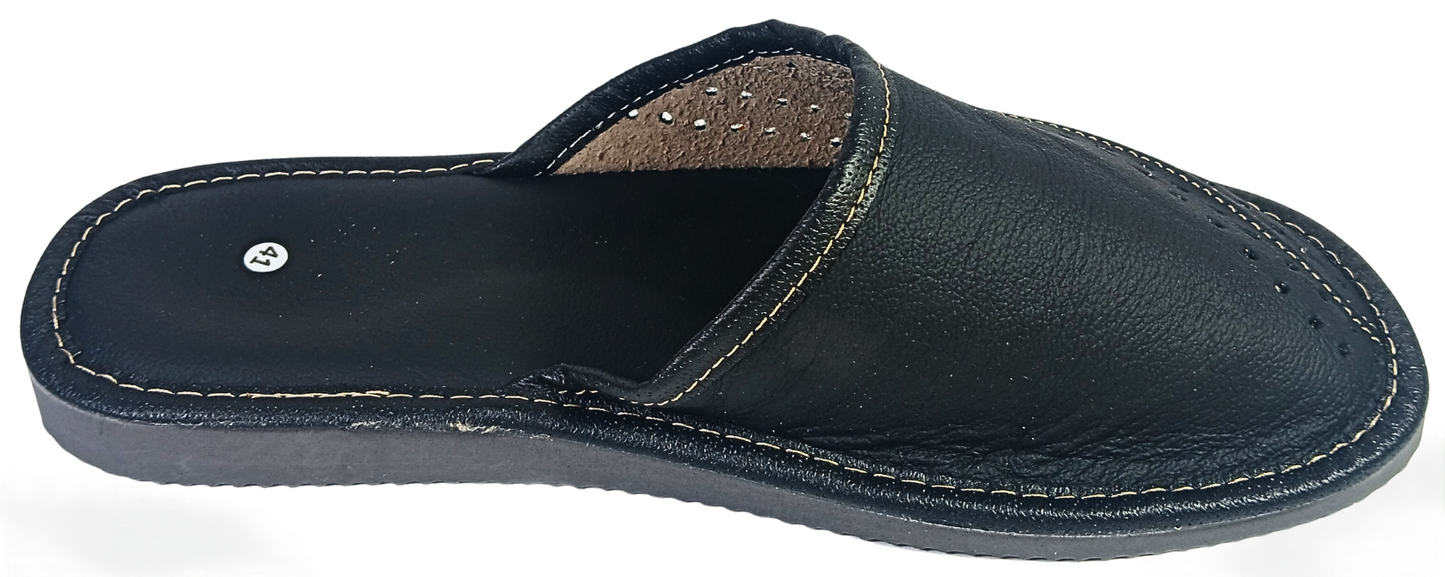 Three-quarter front view of pair of men's black buffalo leather closed-toe mule slippers showing dual-zone perforated vamp and white contrast stitching — The Leather Gift Co
