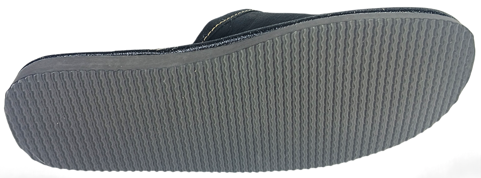 Sole view of men's black buffalo leather closed-toe mule slipper showing full grey ribbed rubber outsole with wave traction pattern — The Leather Gift Co