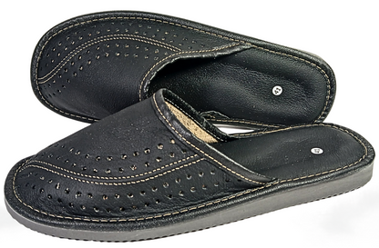 Pair of men's black buffalo leather closed-toe mule slippers showing perforated dot vamp, white stitching and grey rubber outsole — The Leather Gift Co