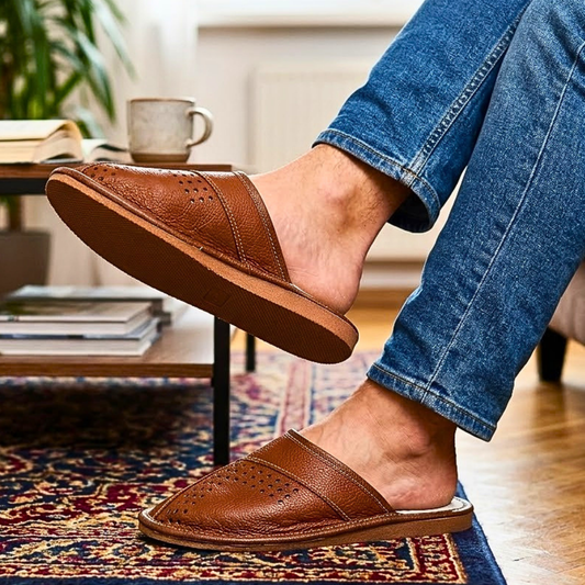 Top-down view of men's tan brown closed-toe leather slipper showing perforated vamp detail and cream leather insole — The Leather Gift Co